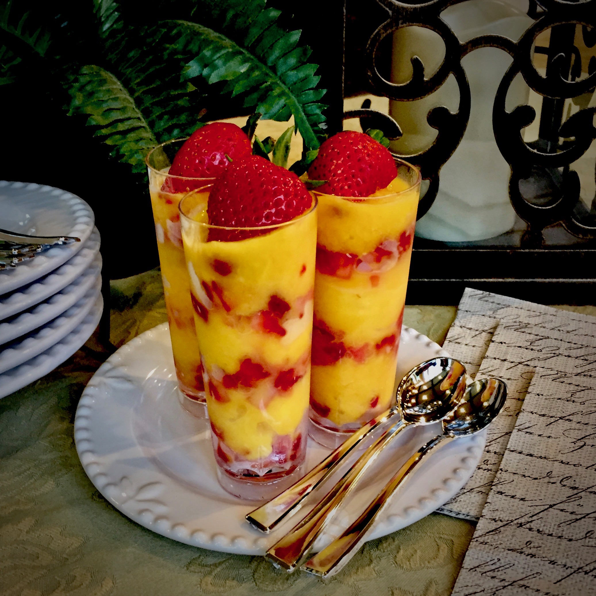 One Ingredient Mango Sorbet Layered with Diced Strawberries.